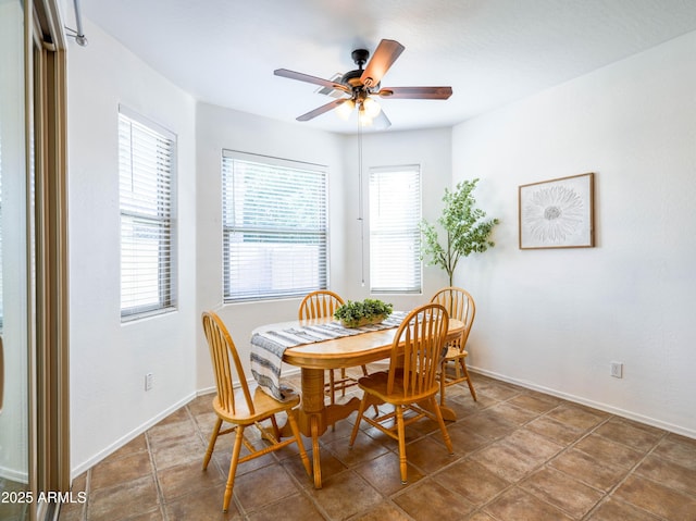 19403 E Arrowhead Trl, Queen Creek, AZ 85142 - tiled dining room featuring a ceiling fan and baseboards