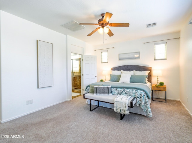 19403 E Arrowhead Trl, Queen Creek, AZ 85142 - carpeted bedroom with multiple windows, baseboards, ensuite bathroom, and a ceiling fan
