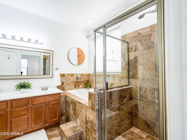 19403 E Arrowhead Trl, Queen Creek, AZ 85142 - bathroom featuring a shower stall, a bath, and double vanity