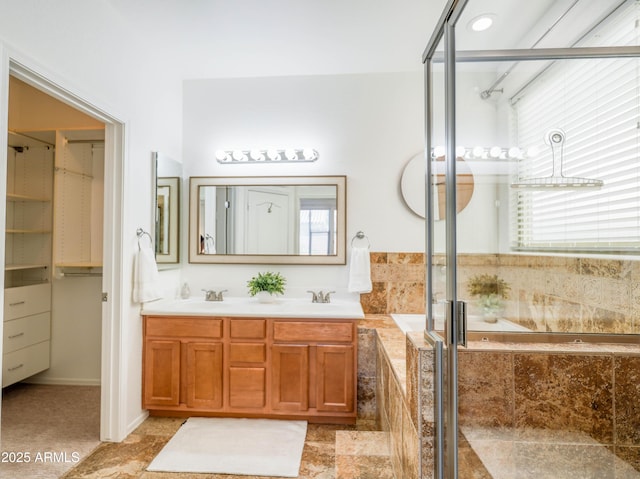 19403 E Arrowhead Trl, Queen Creek, AZ 85142 - bathroom featuring a garden tub, double vanity, a closet, and a shower with shower door