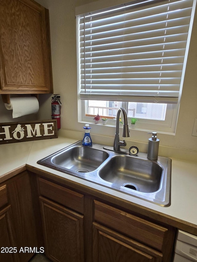 kitchen with sink and dishwashing machine