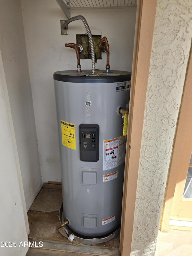 utility room featuring water heater