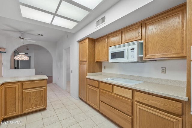 kitchen featuring ceiling fan, white appliances, and light tile patterned floors