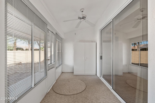 hall featuring light colored carpet