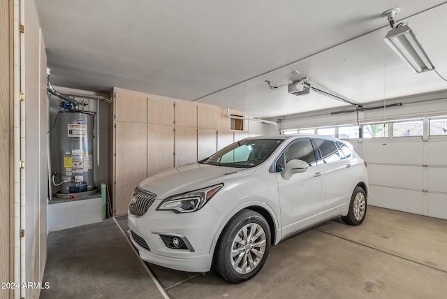 garage with a garage door opener and gas water heater