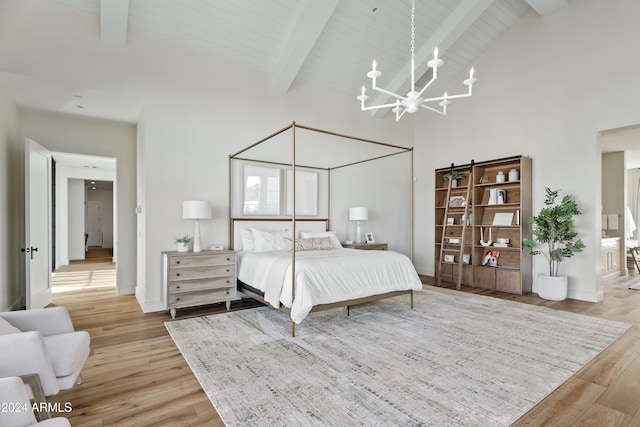 bedroom featuring beamed ceiling, an inviting chandelier, light hardwood / wood-style floors, and high vaulted ceiling