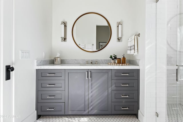 bathroom featuring tile patterned floors, vanity, and walk in shower