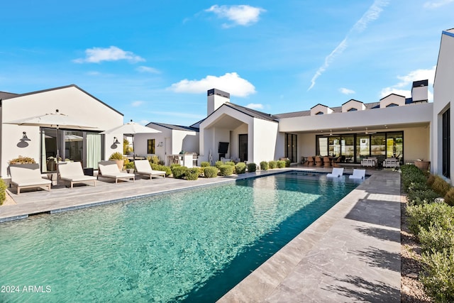 view of swimming pool featuring a patio area