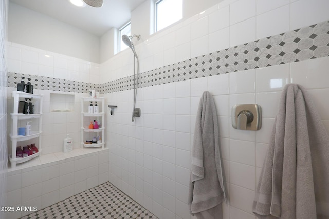 bathroom with tiled shower