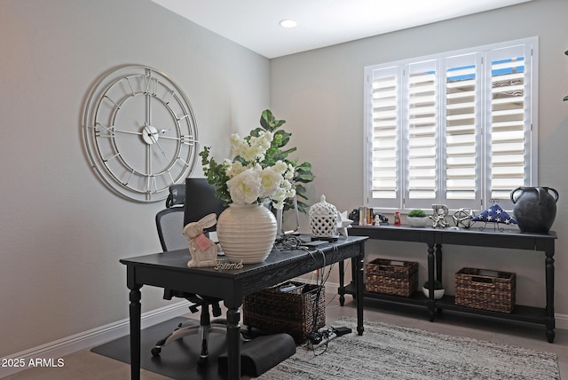 office featuring plenty of natural light and baseboards