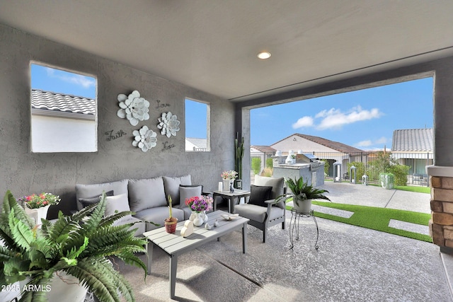 view of patio featuring outdoor lounge area and fence