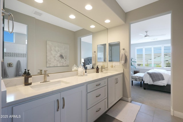 bathroom with recessed lighting, a sink, and connected bathroom