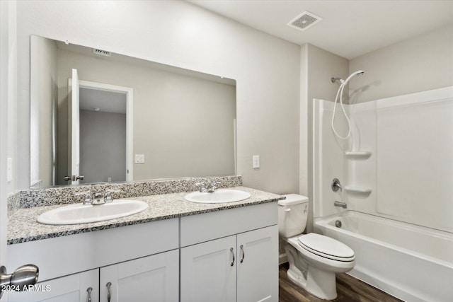 full bathroom with vanity, shower / tub combination, wood-type flooring, and toilet