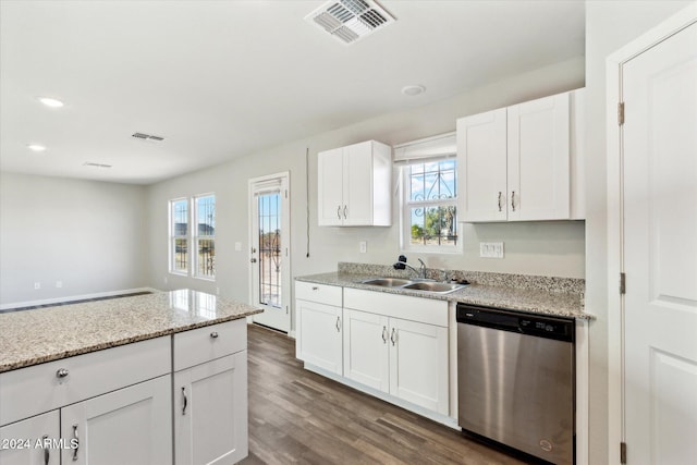 kitchen featuring dark wood-type flooring, sink, light stone countertops, stainless steel dishwasher, and white cabinetry