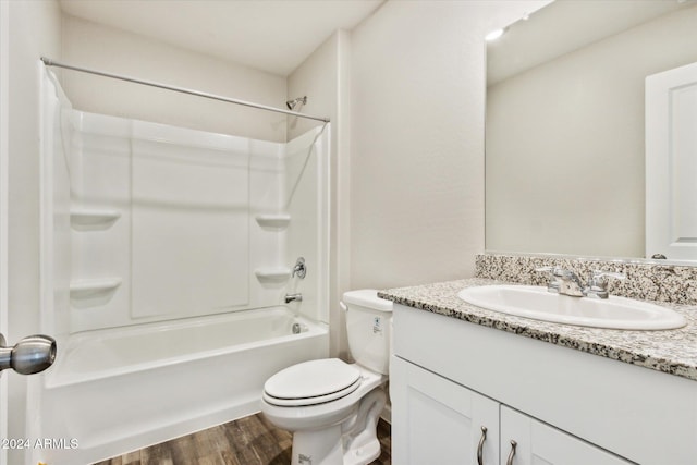 full bathroom featuring vanity, toilet, wood-type flooring, and tub / shower combination