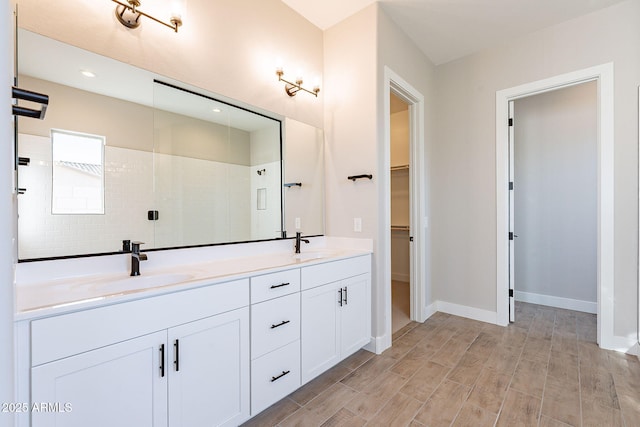 bathroom with vanity and walk in shower