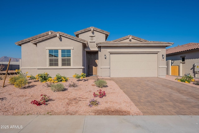 view of front of house featuring a mountain view and a garage