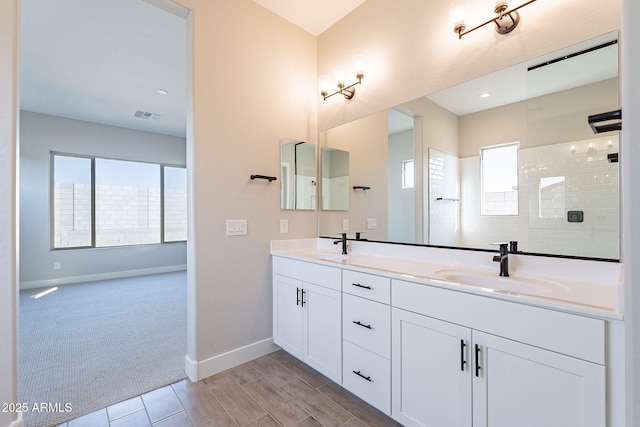 bathroom featuring vanity and walk in shower