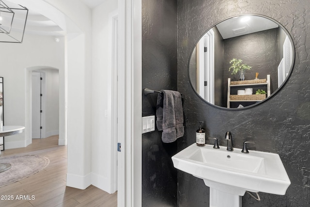 bathroom featuring a sink and wood finished floors