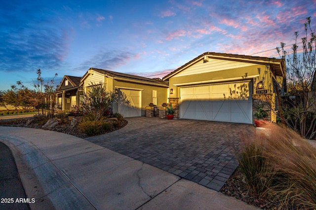 11385 N Luckenbach St, Surprise, AZ 85388 - single story home with driveway, an attached garage, and stucco siding