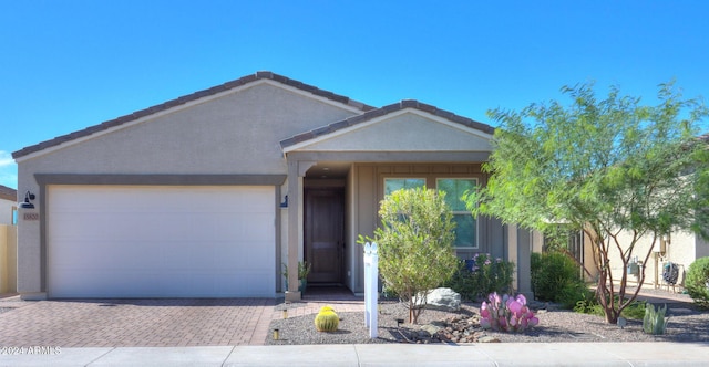 single story home featuring a garage