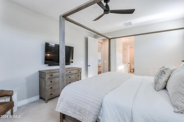 carpeted bedroom with connected bathroom and ceiling fan