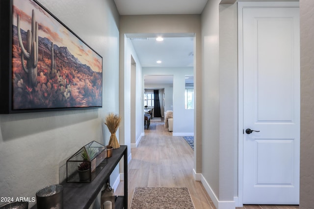 hall with light wood-type flooring