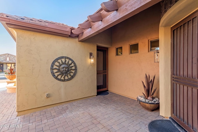 doorway to property with a patio area