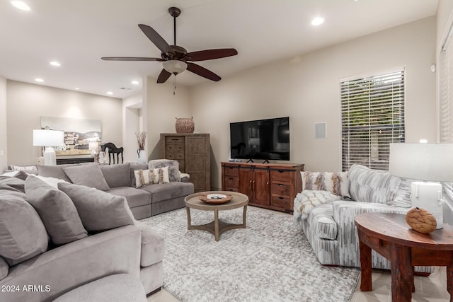 tiled living room featuring ceiling fan