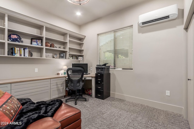 office with light colored carpet, built in desk, and a wall mounted air conditioner