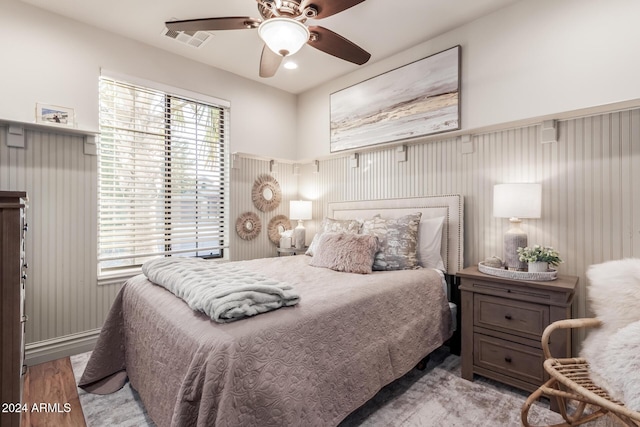 bedroom with light wood-type flooring and ceiling fan