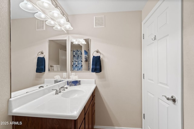 bathroom with baseboards, visible vents, vanity, and a shower with shower curtain