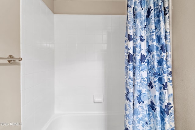 full bathroom with a tub and a shower with shower curtain