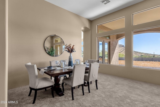 view of carpeted dining space