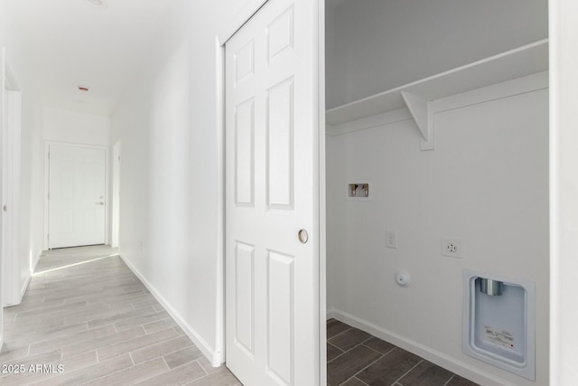 clothes washing area with washer hookup, wood tiled floor, hookup for an electric dryer, gas dryer hookup, and laundry area