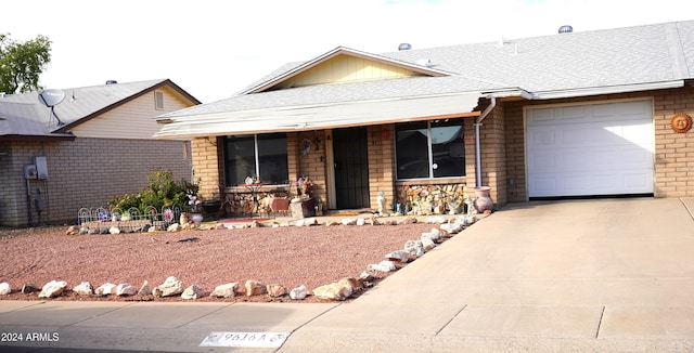 single story home featuring a garage