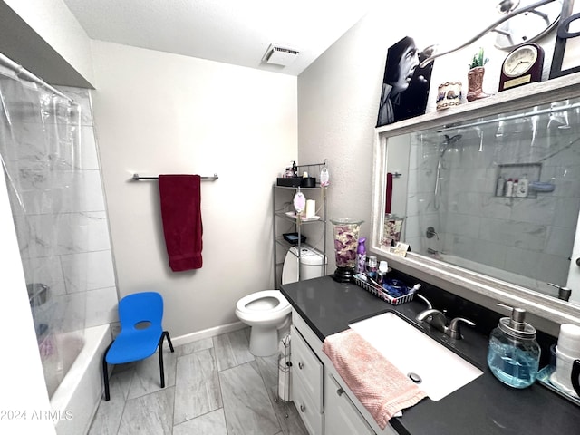 full bathroom featuring bathing tub / shower combination, vanity, and toilet