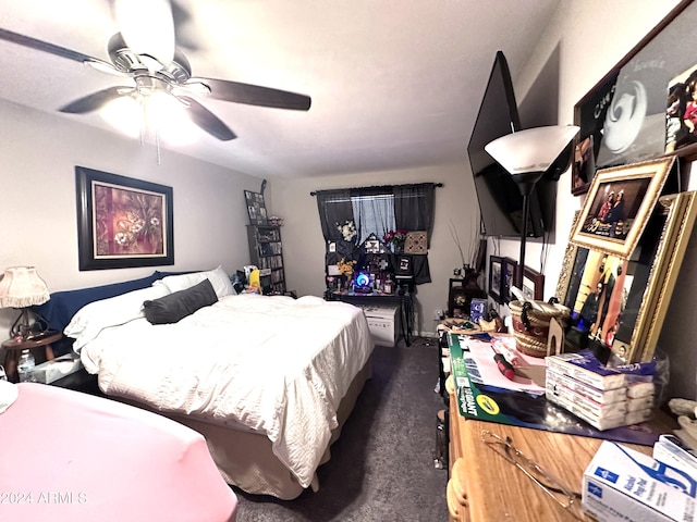 bedroom featuring dark colored carpet and ceiling fan