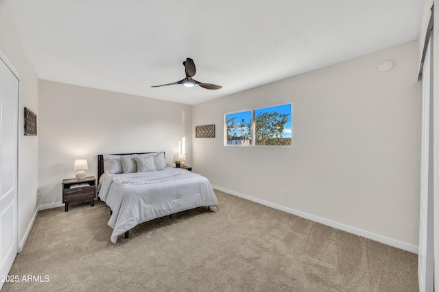 bedroom with carpet flooring, baseboards, and ceiling fan