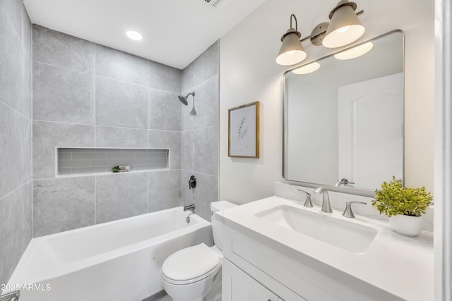 full bathroom featuring bathing tub / shower combination, toilet, and vanity