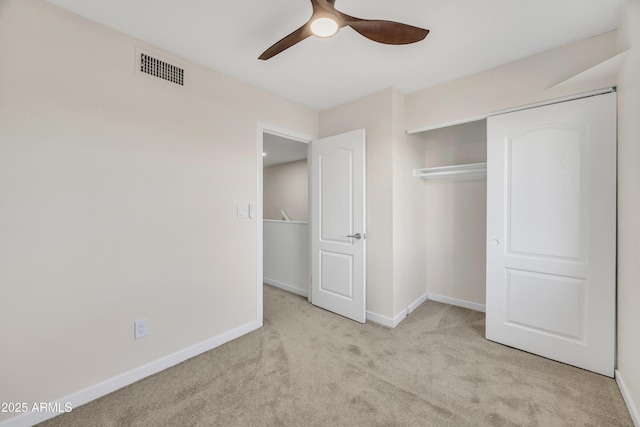 unfurnished bedroom with visible vents, ceiling fan, baseboards, and carpet floors