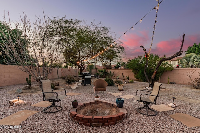 yard at dusk with a patio area