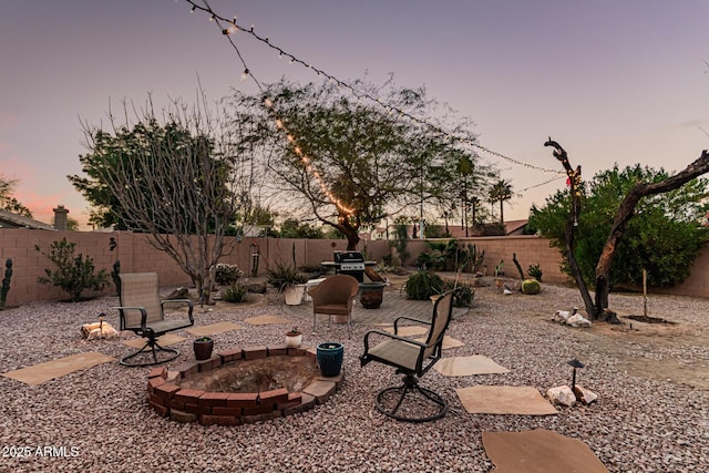 yard at dusk with a patio