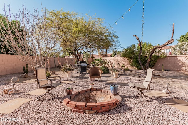 view of yard with an outdoor fire pit and a patio area