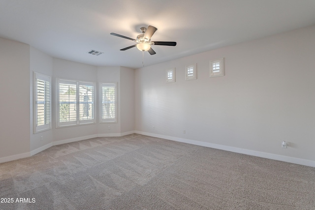 unfurnished room with light carpet and ceiling fan