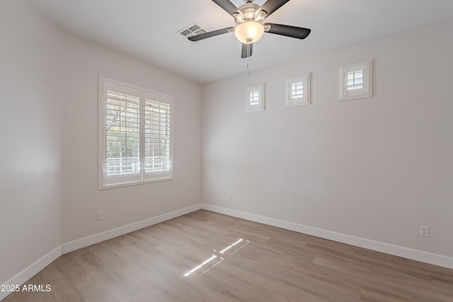 unfurnished room with light hardwood / wood-style flooring and ceiling fan