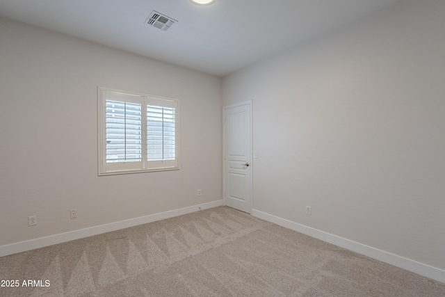 unfurnished room with light colored carpet