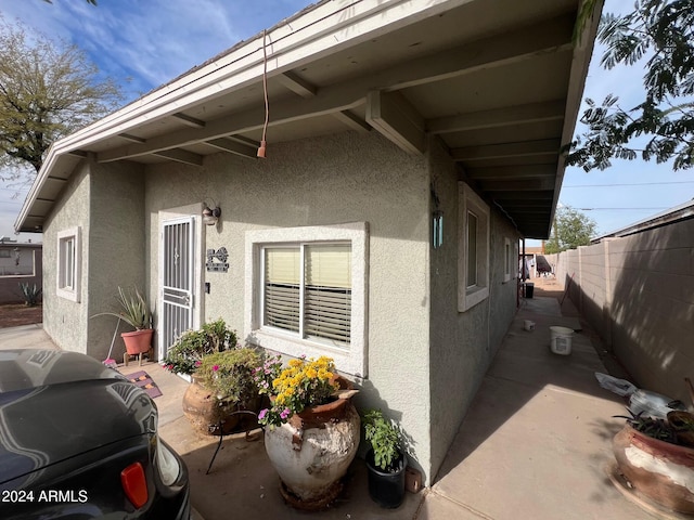 view of side of property with a patio