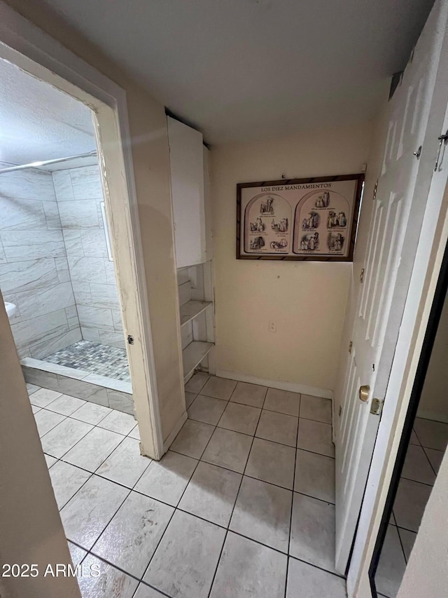 hallway with light tile patterned flooring