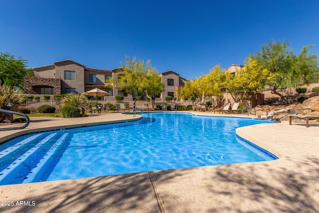 7445 E Eagle Crest Dr Unit 1145, Mesa, AZ 85207 - community pool with a patio, fence, and a residential view